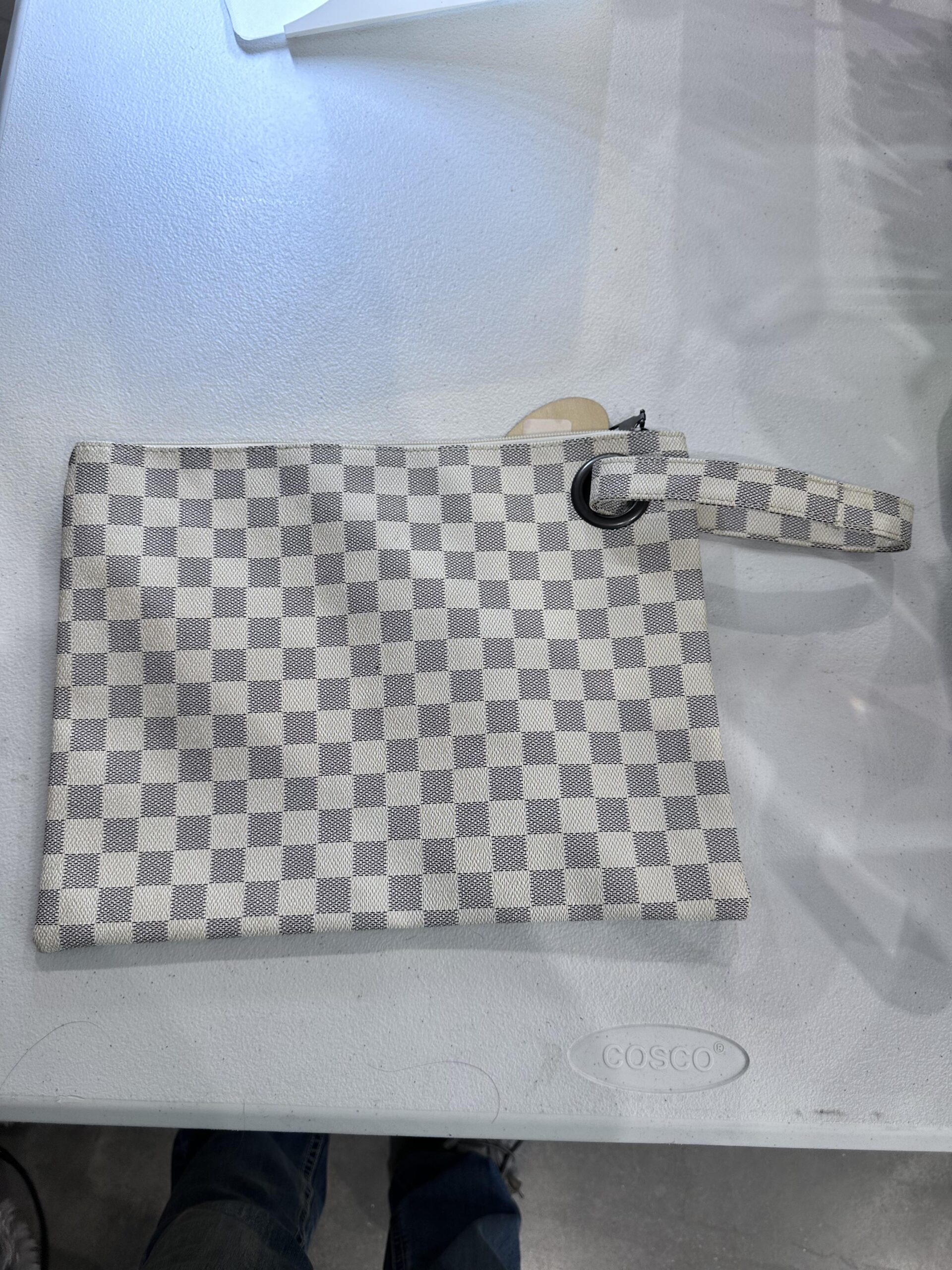 white and grey checkered wristlet