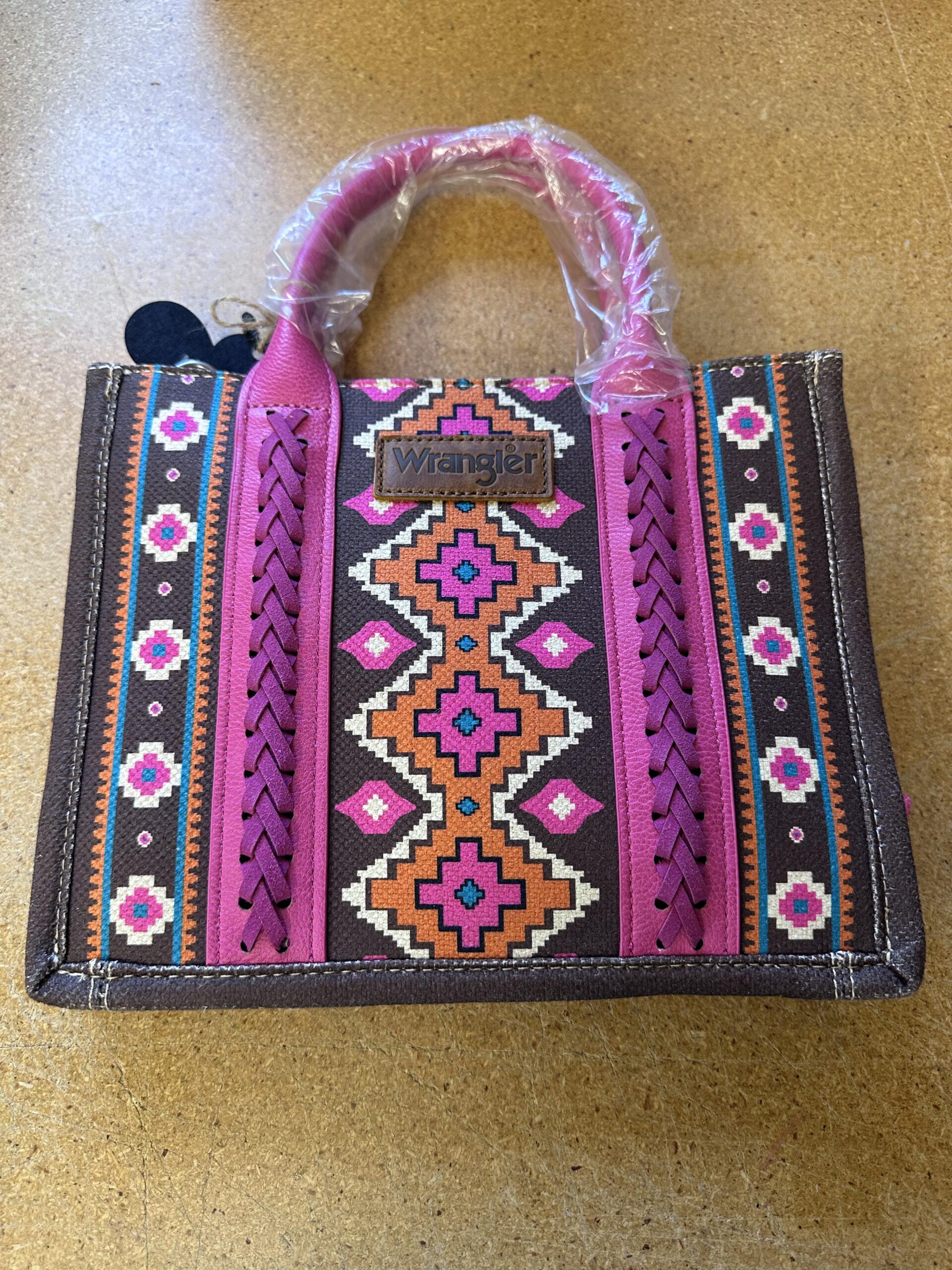 Small sized pink and black Wrangler purse